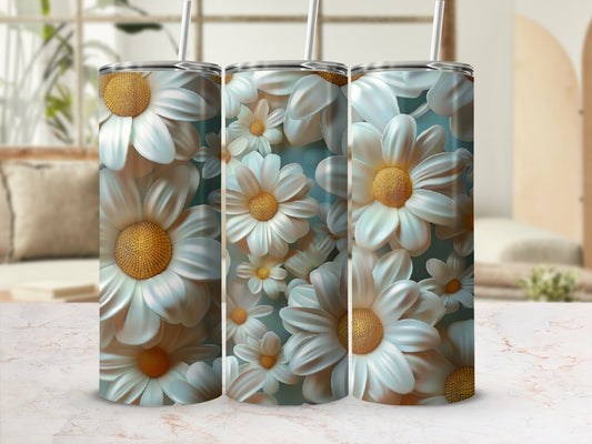 Three tumblers decorated with a pattern of large white daisies and yellow centers.