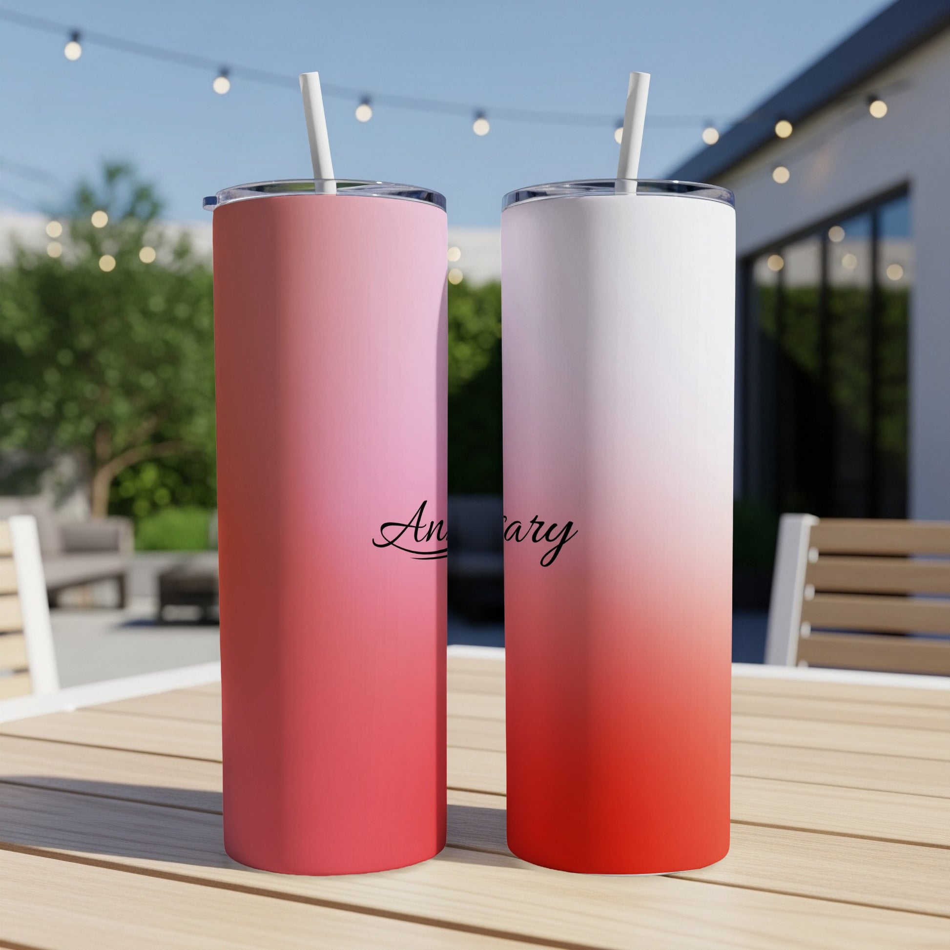 Two skinny tumblers with gradient pink to red and white to red, reading "Anniversary."