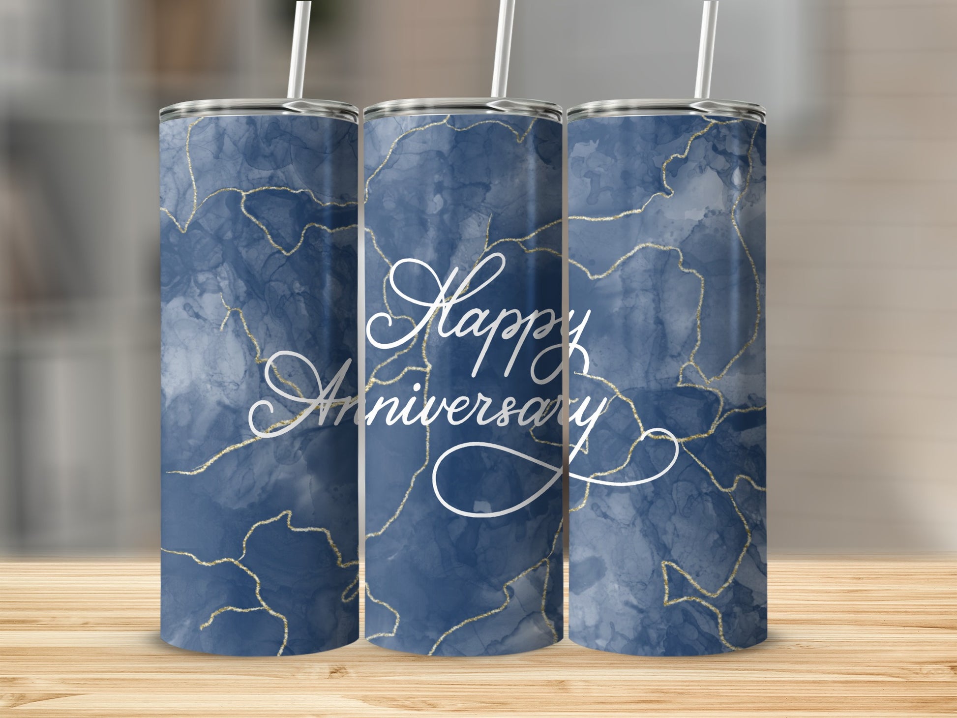 Three navy blue marble tumblers with gold veining and "Happy Anniversary" text.