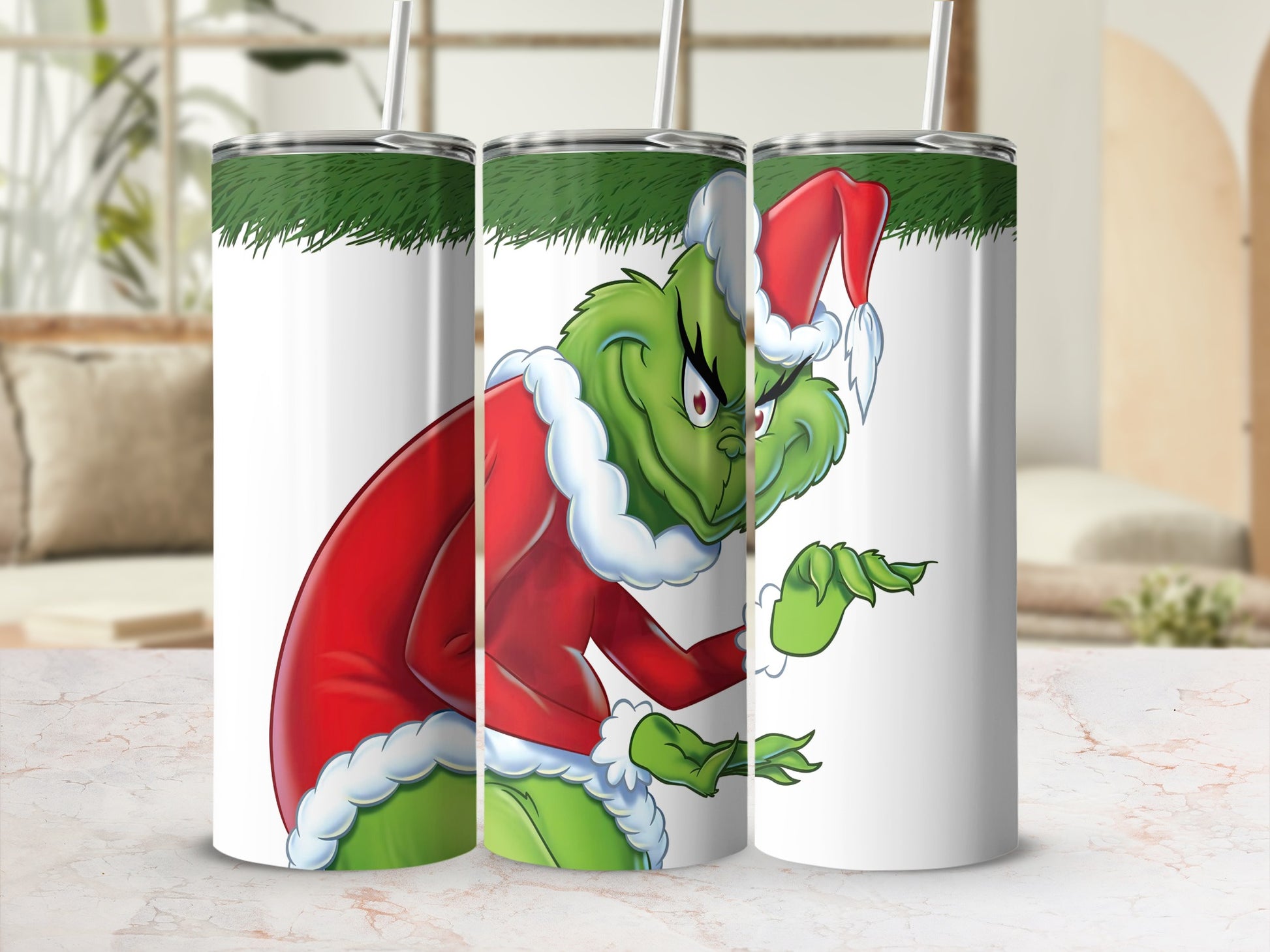 The Grinch in Santa costume with a red hat and green trim on a white tumbler.