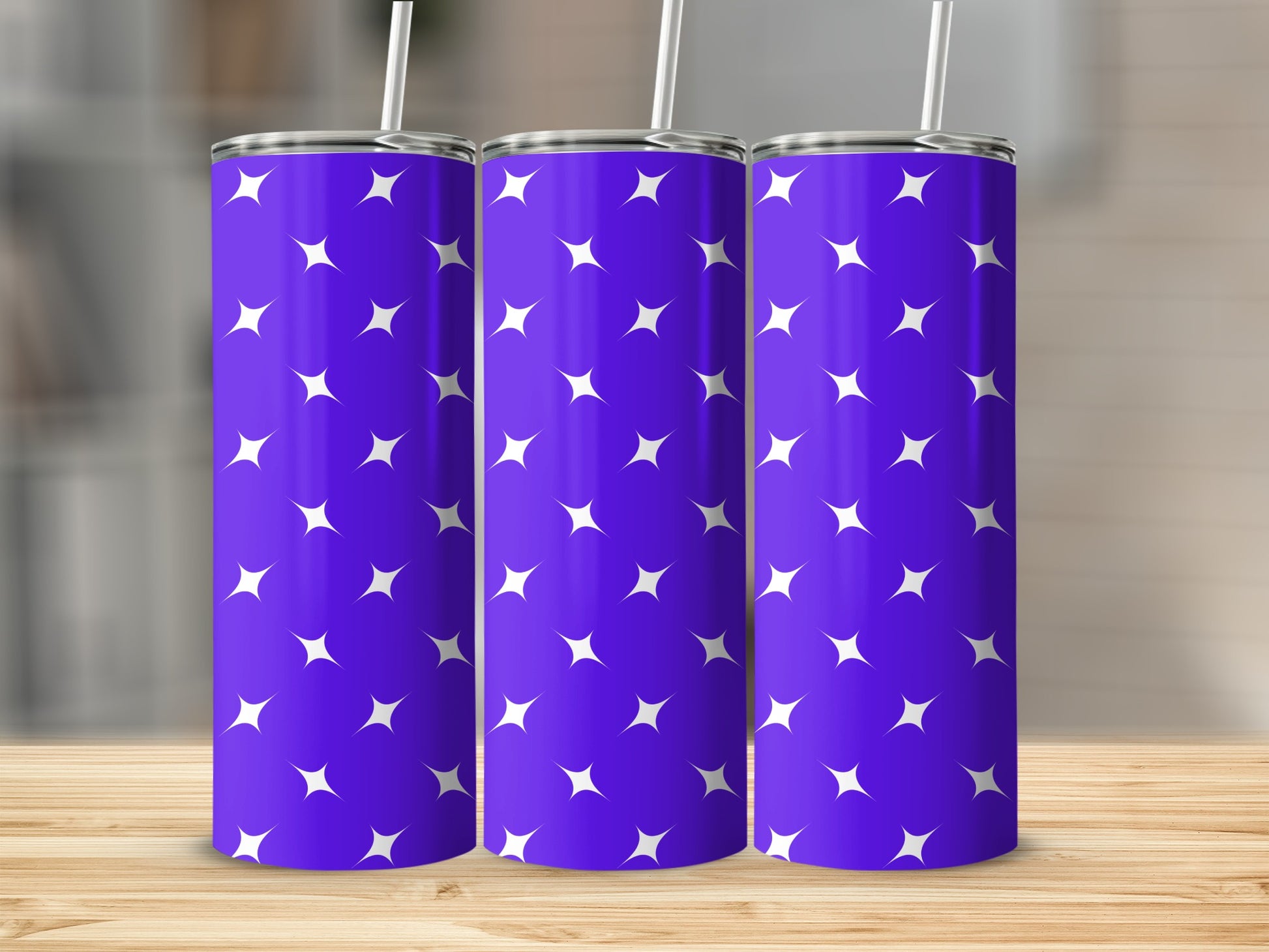 Purple tumbler with a white star pattern and straw.