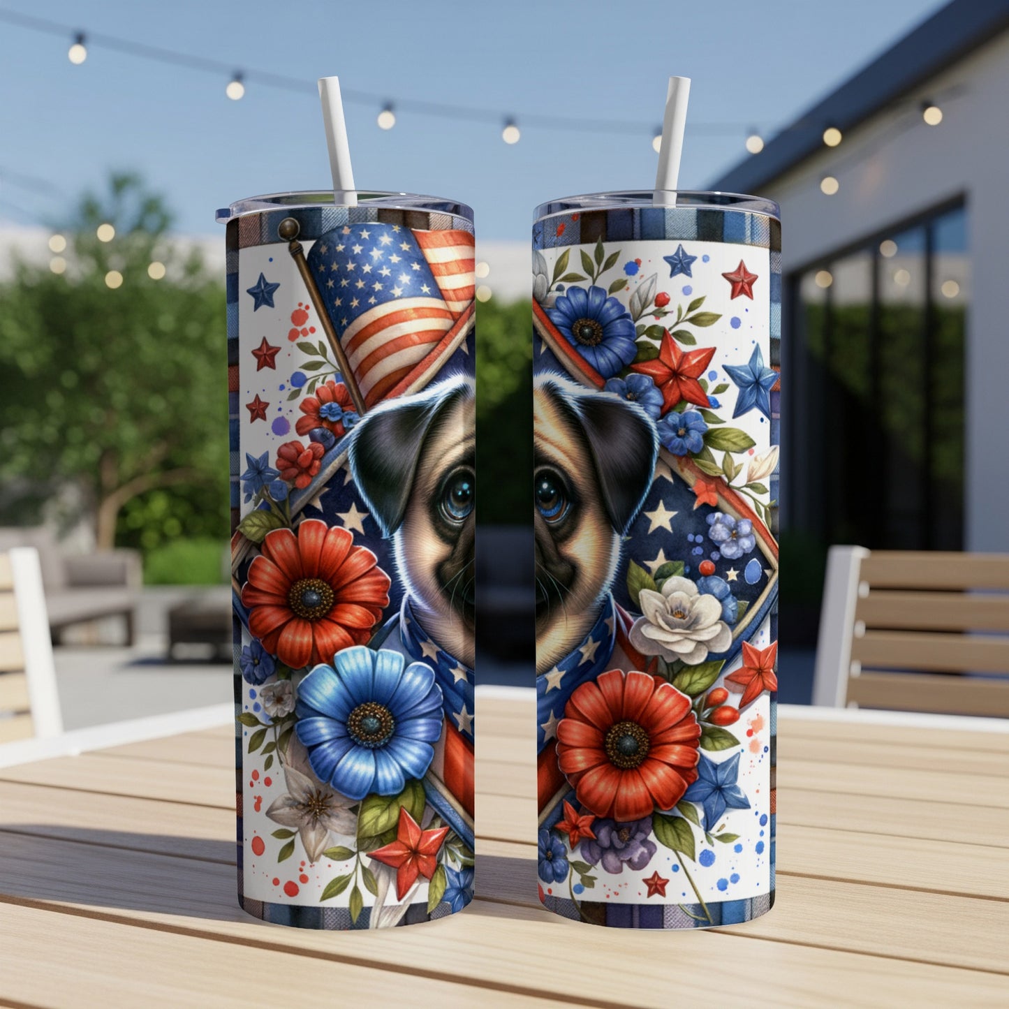 Two patriotic tumblers with dog and floral designs sit on a table outdoors.