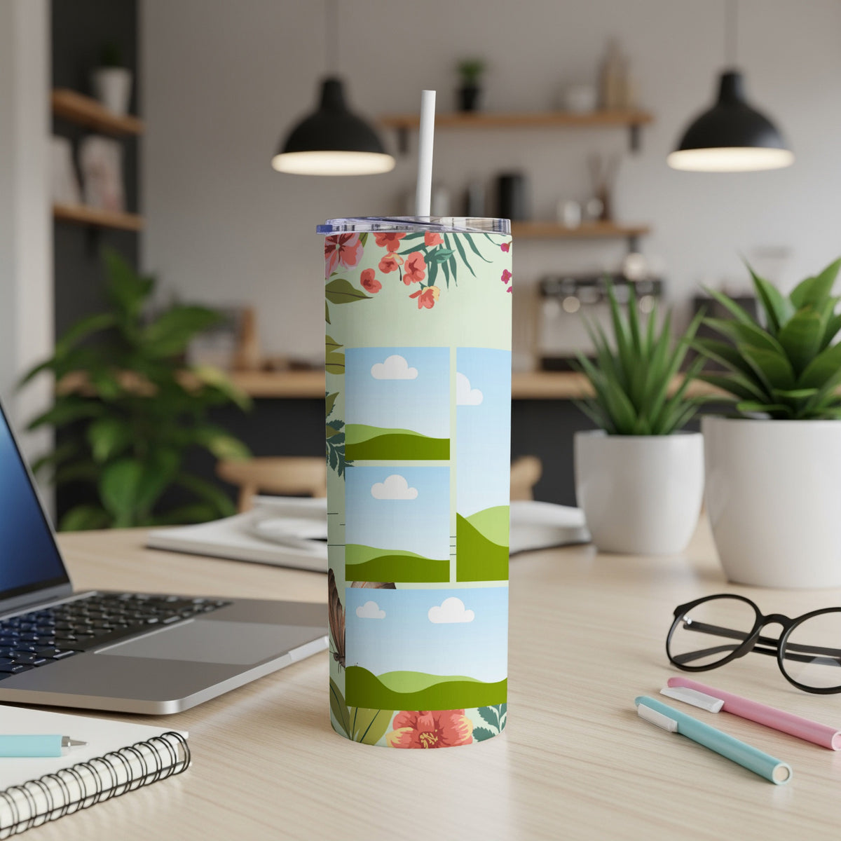 Tumbler with floral pattern and sky landscape collage, white straw and lid.