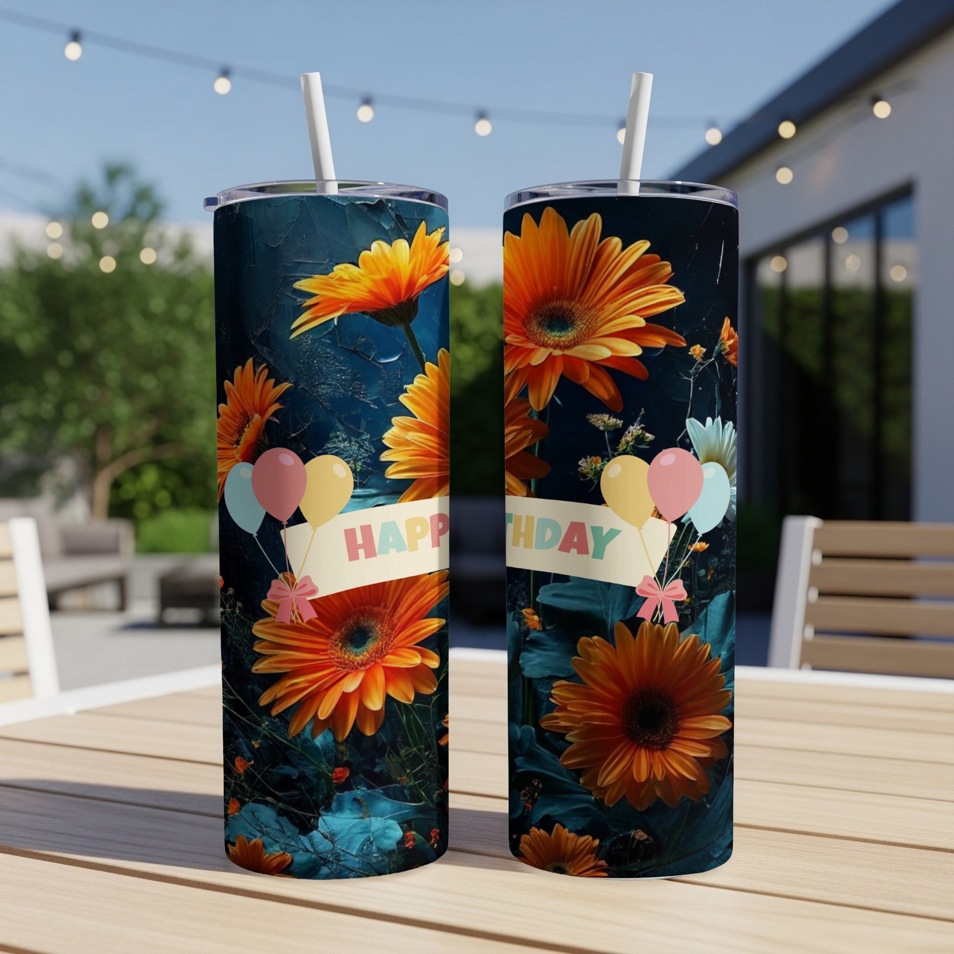 Two tumblers with orange flowers and "Happy Birthday" banner against a dark background.