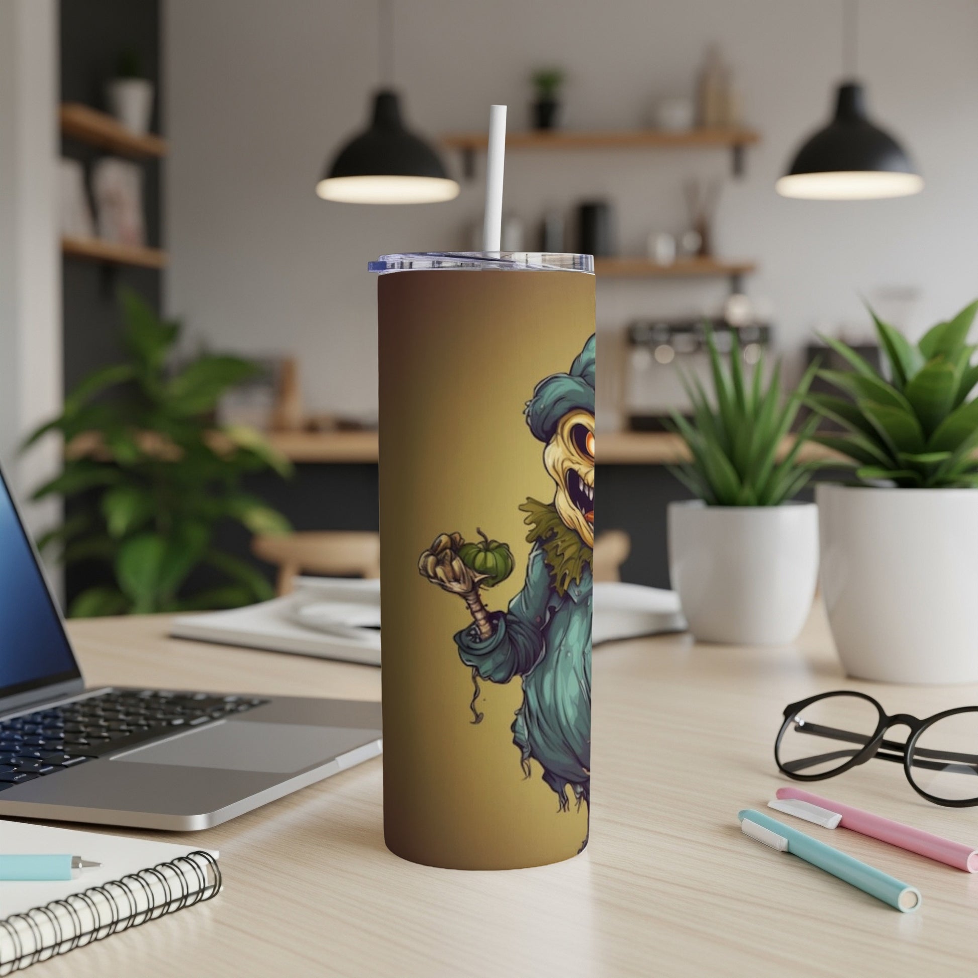 Tumbler with a cartoon scarecrow holding a pumpkin on a brown background.