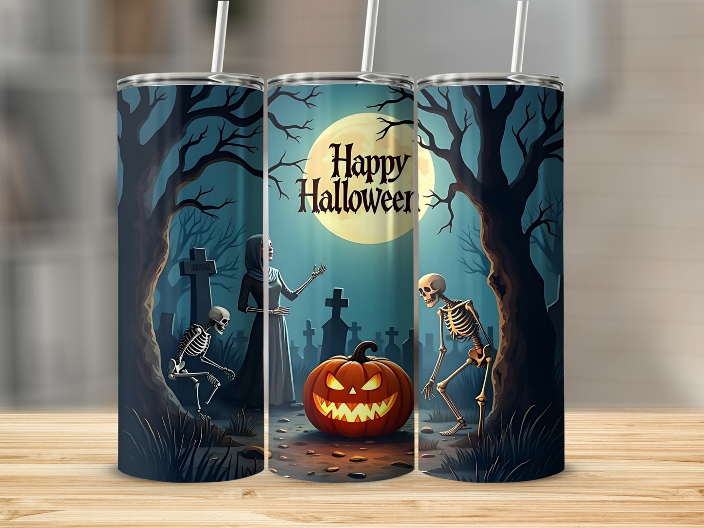 Three tumblers with a spooky Halloween scene featuring skeletons and a pumpkin.