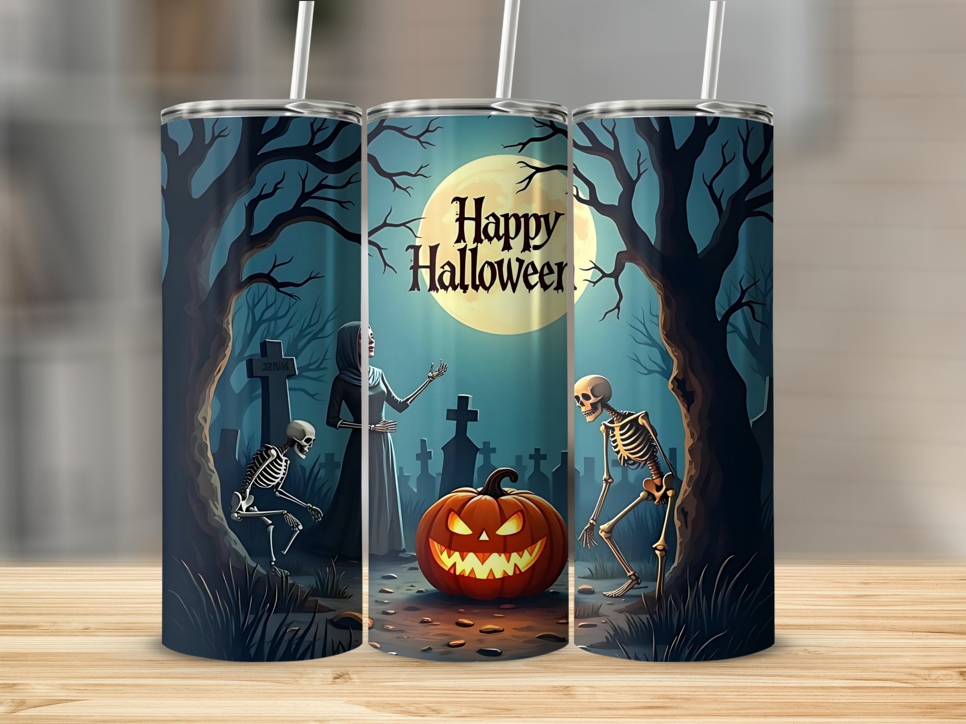 Three tumblers with a spooky Halloween scene featuring skeletons and a pumpkin.