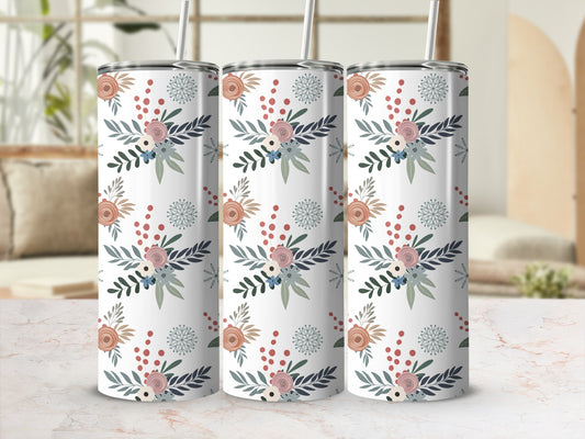 Three tumblers with a floral pattern on a marble surface.