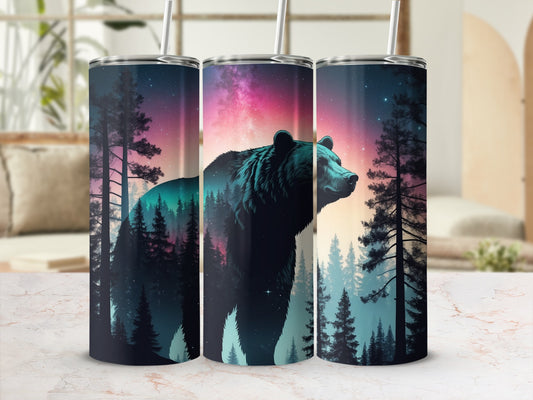 Tumbler with silhouette of a bear against a starry, colorful forest scene.