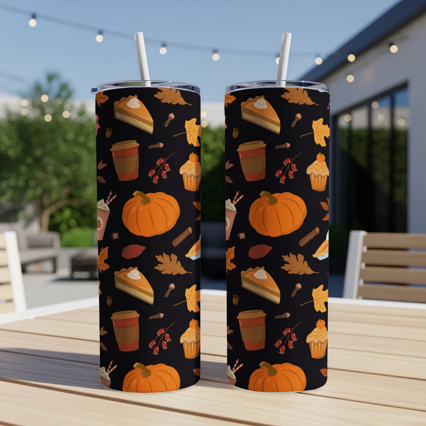 Two tumblers with fall-themed pattern of pumpkins, pie, and leaves.