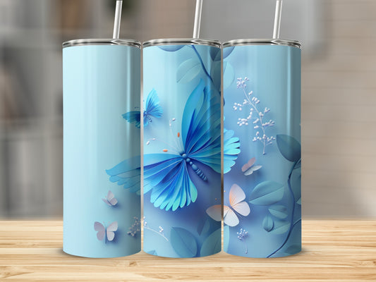 Blue tumbler with butterflies and floral accents.