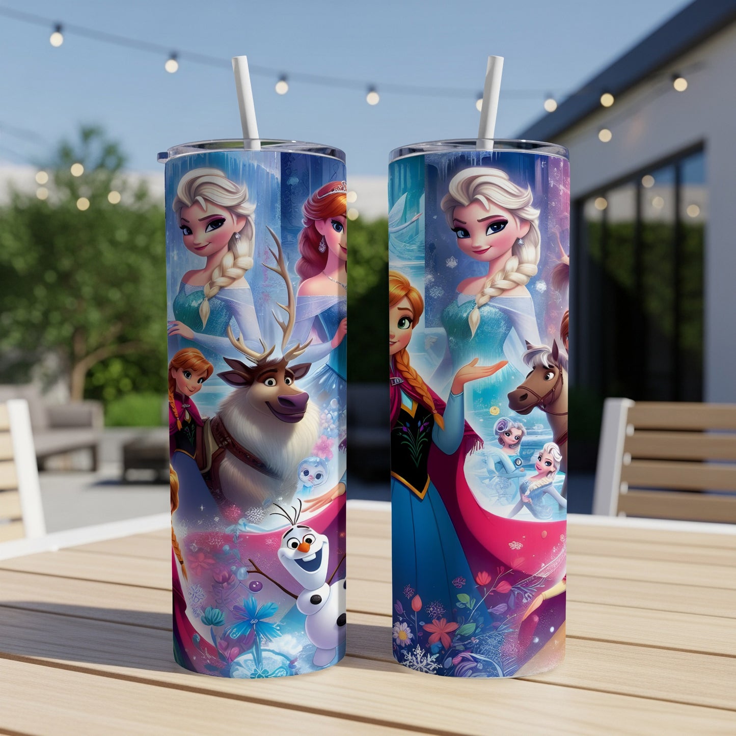 Two Disney Frozen-themed tumblers with characters and snowflakes on a wooden table.
