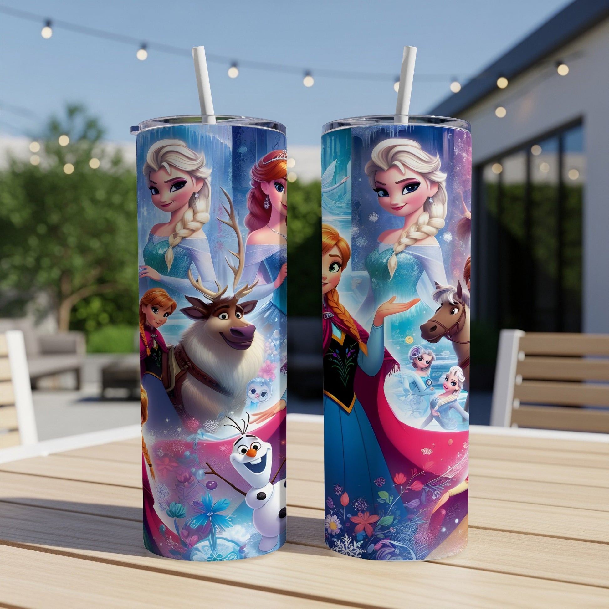 Two Disney Frozen-themed tumblers with characters and snowflakes on a wooden table.