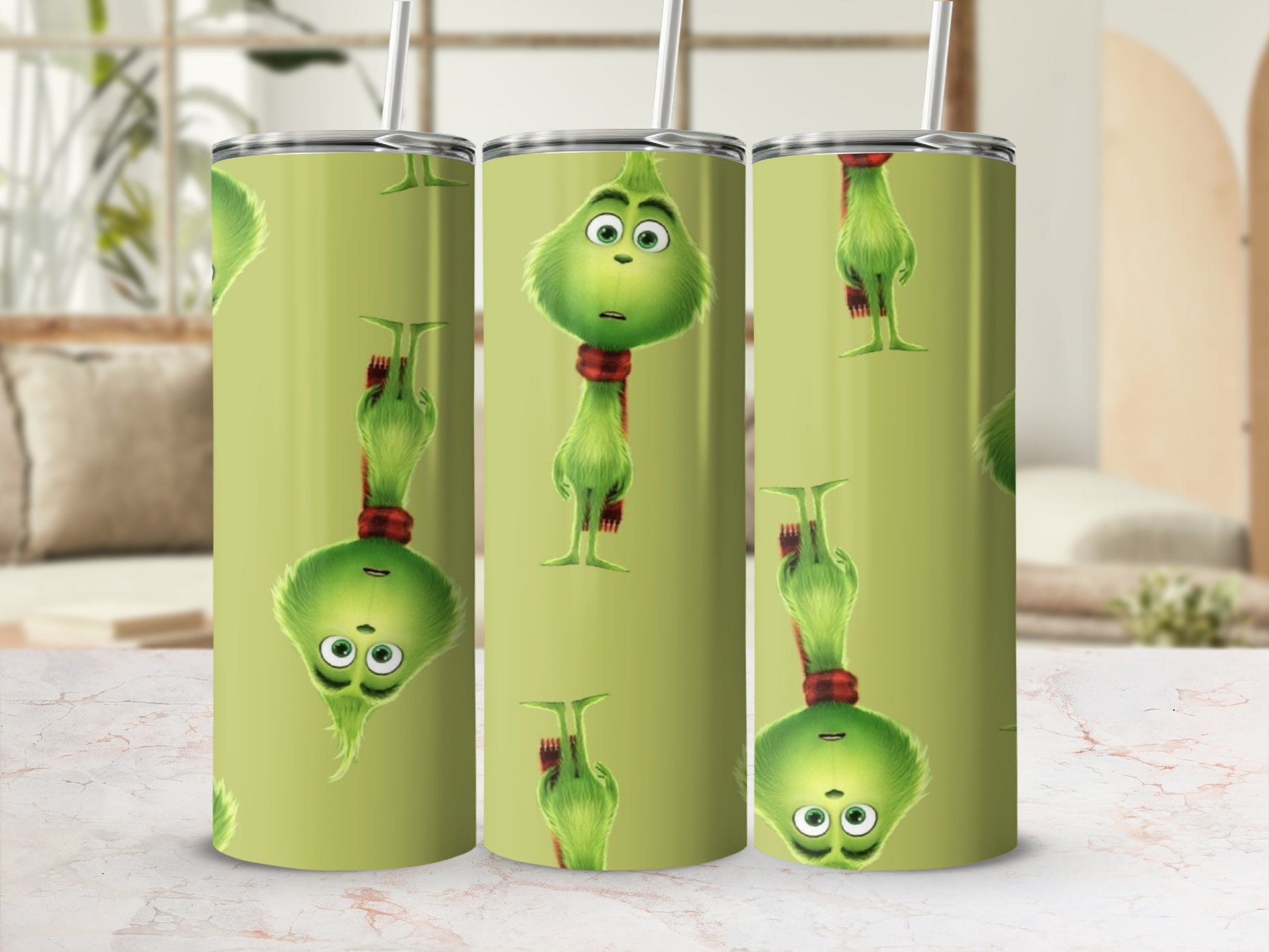 Grinch character design repeating on a light green tumbler with a straw.
