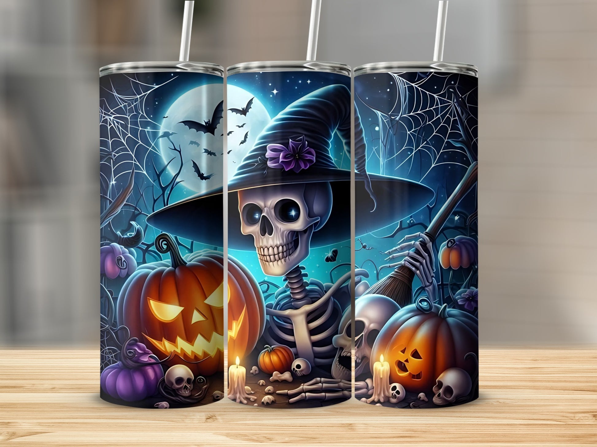 Halloween tumblers with skeletons, pumpkins, bats, spiderwebs, and a full moon.