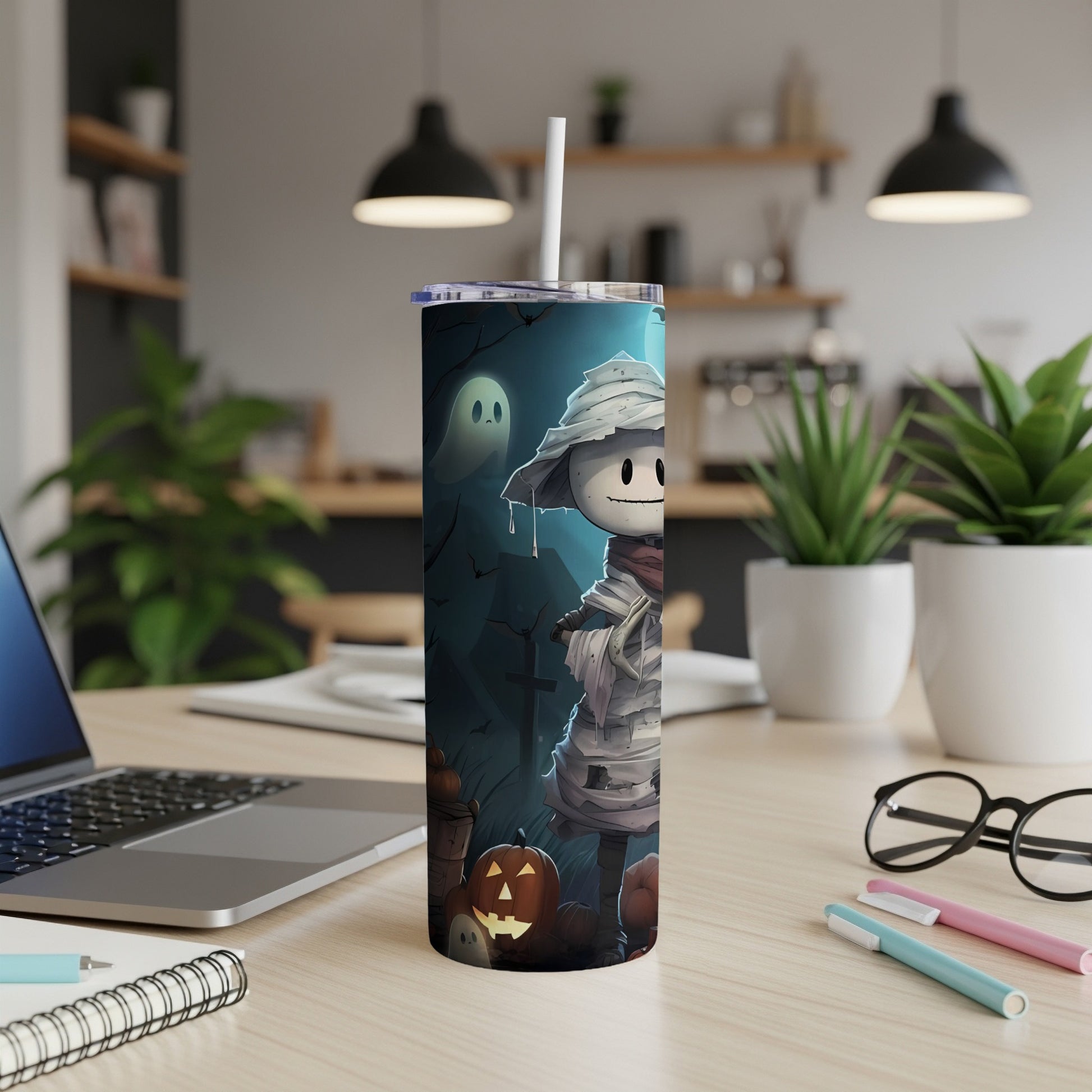 Tumbler with mummy, ghost, pumpkins, and bats Halloween design.