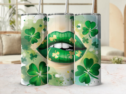 Green shamrocks and gold teeth on a woman's lips, on a tumbler.