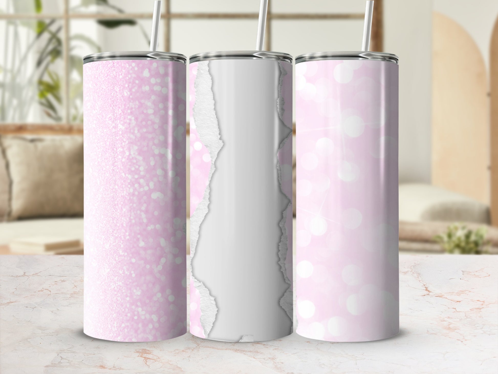 Three pink glitter and torn paper pattern tumblers with straws.