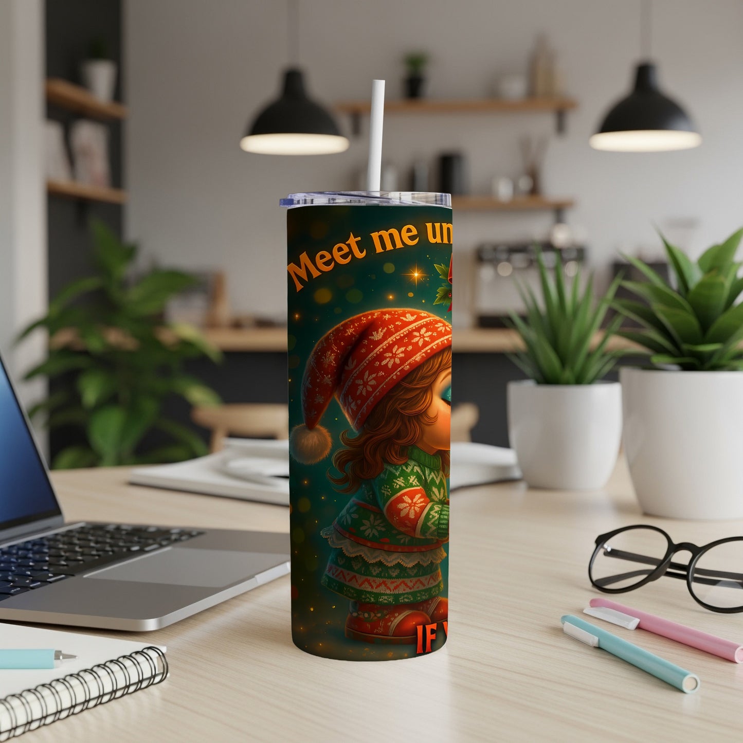 Tumbler with "Meet me un" and a Christmas elf design.