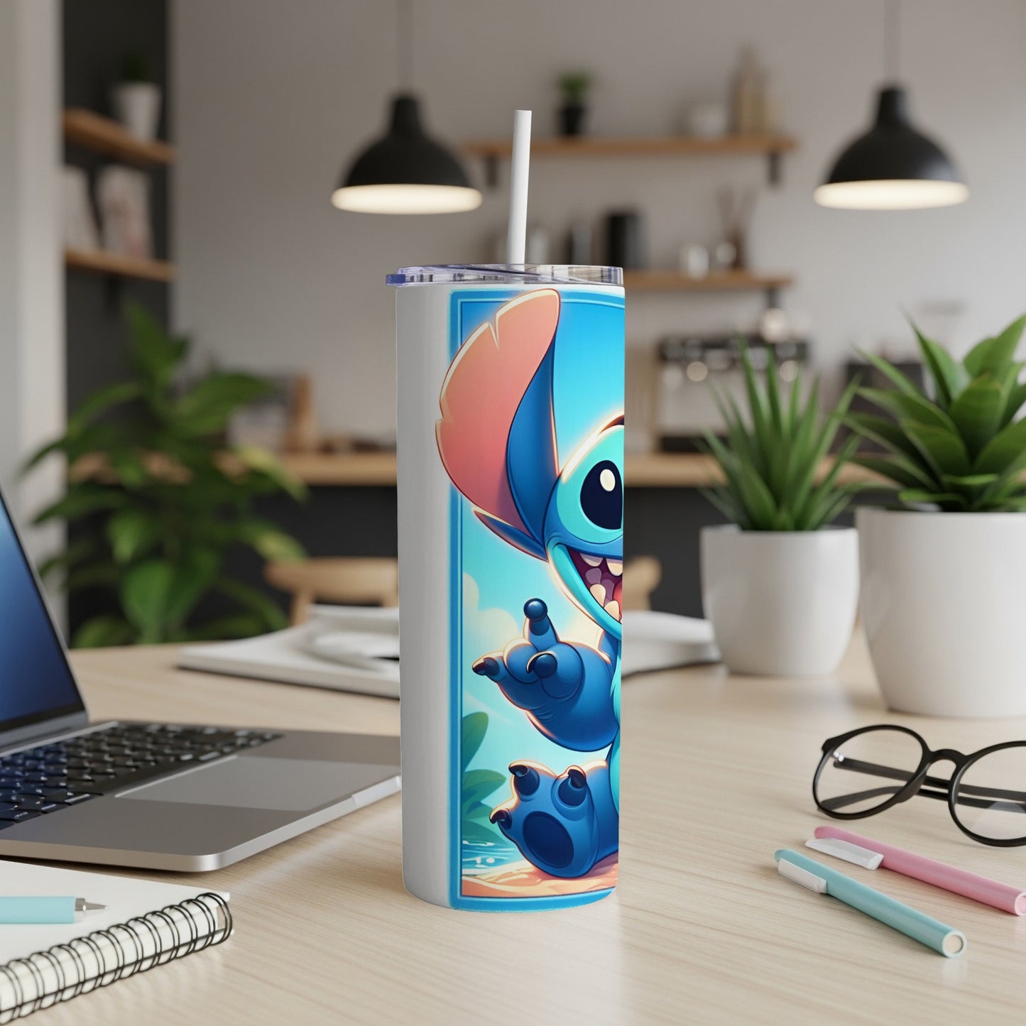 Blue cartoon alien character Stitch on a white tumbler with straw.