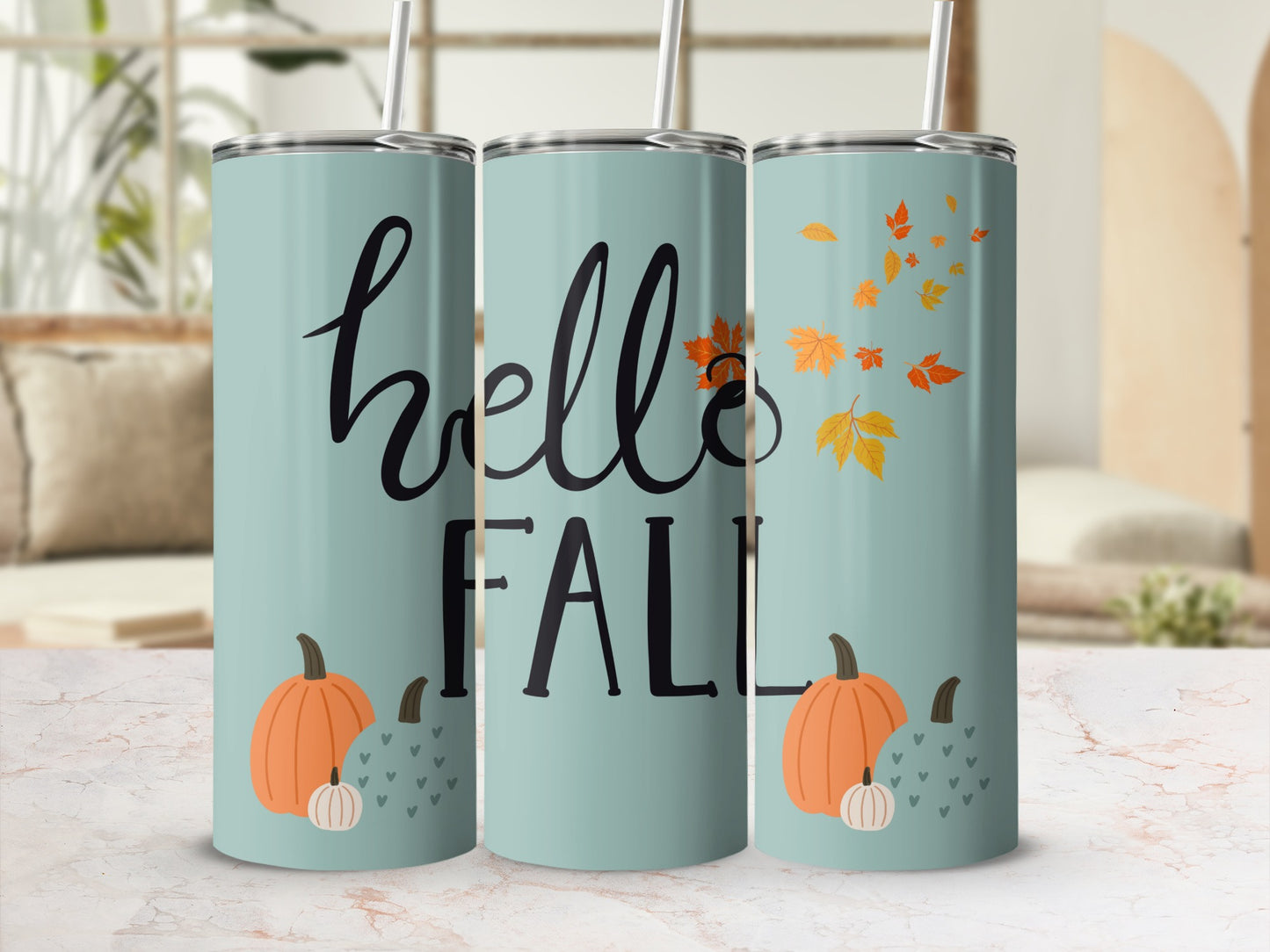 Three teal tumblers with "hello FALL" and pumpkin and leaf designs.