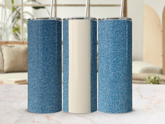 Three glittery blue tumblers with beige centers displayed on a marble surface.
