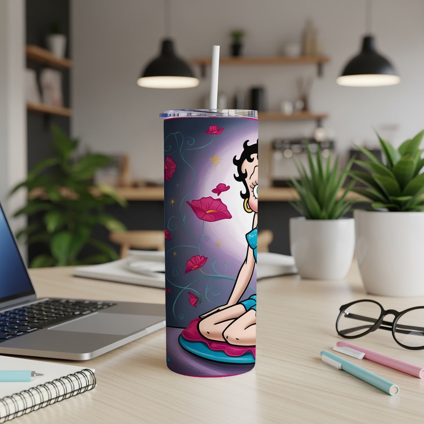 Betty Boop illustration on a blue tumbler with pink flowers.