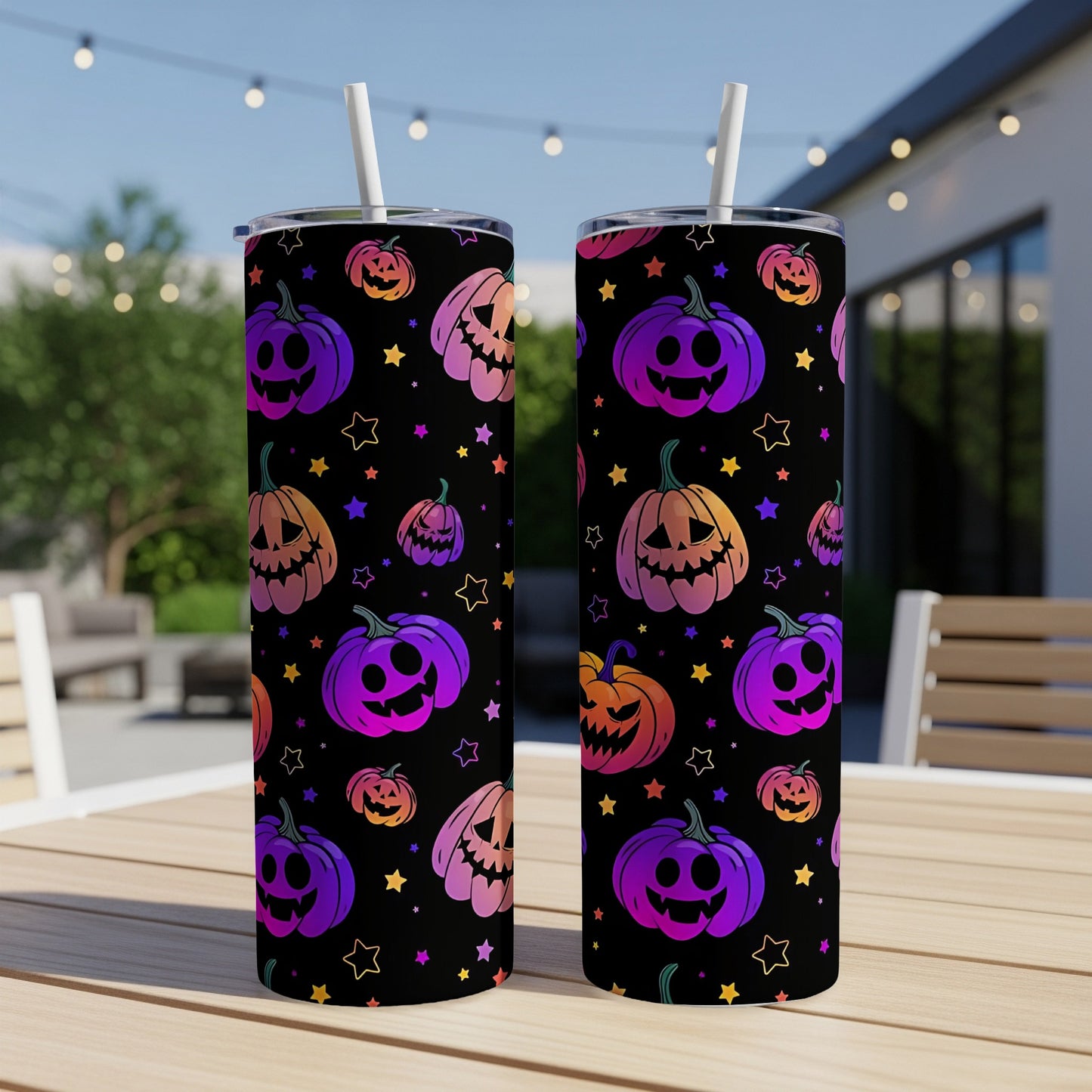 Two tumblers with a repeating pattern of purple and orange gradient jack-o'-lanterns and stars.