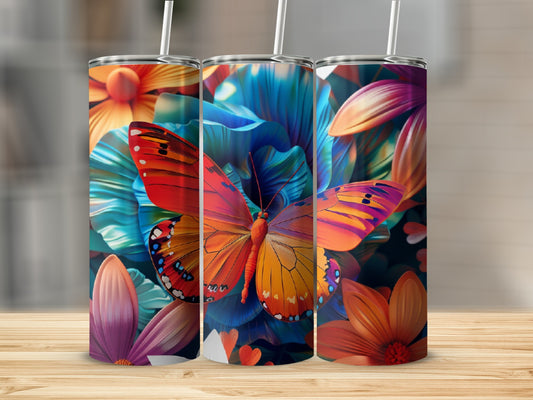 Three tumblers with colorful floral and butterfly designs.