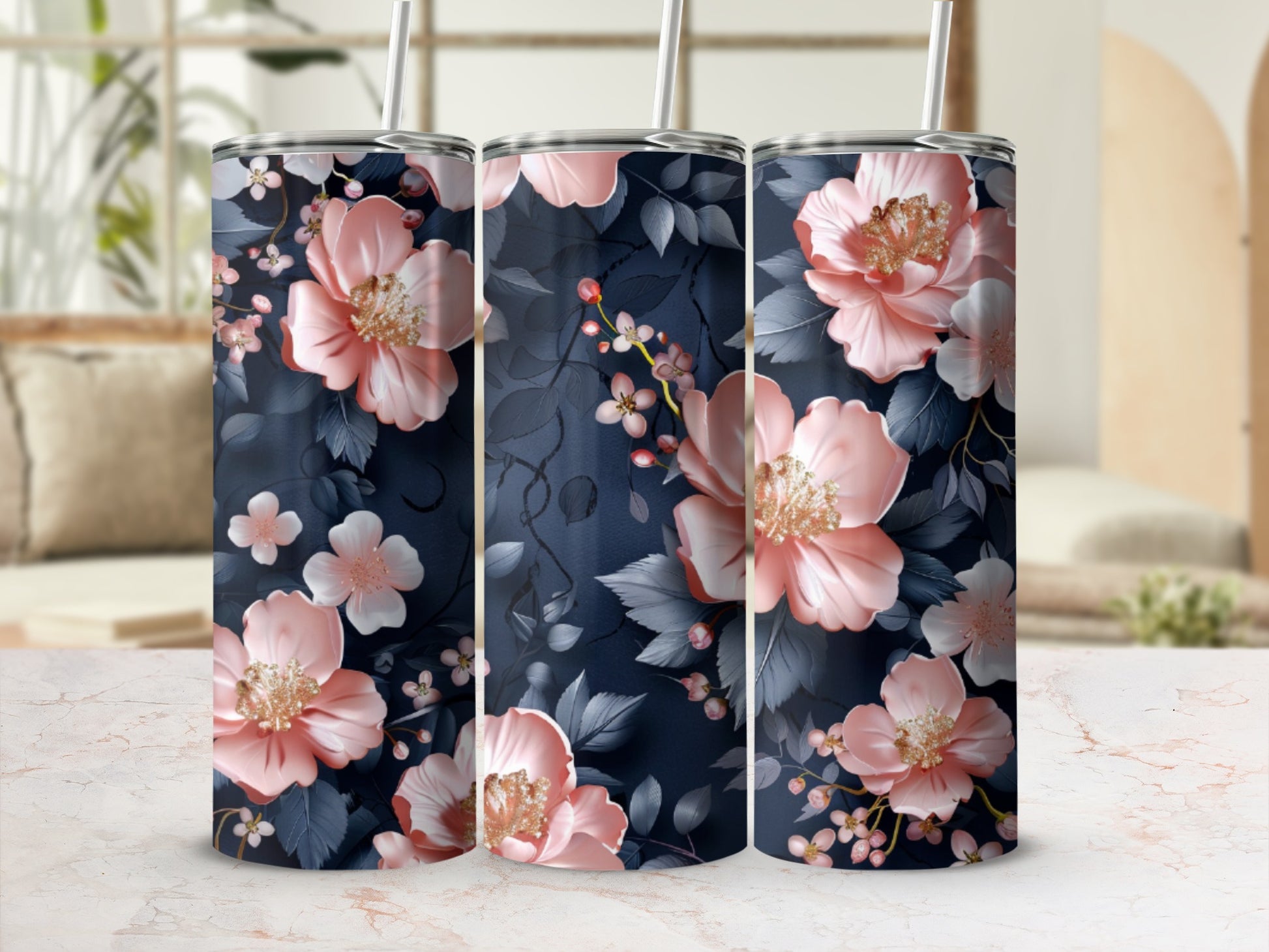 Three tumblers featuring a navy blue background with pink floral and vine patterns.
