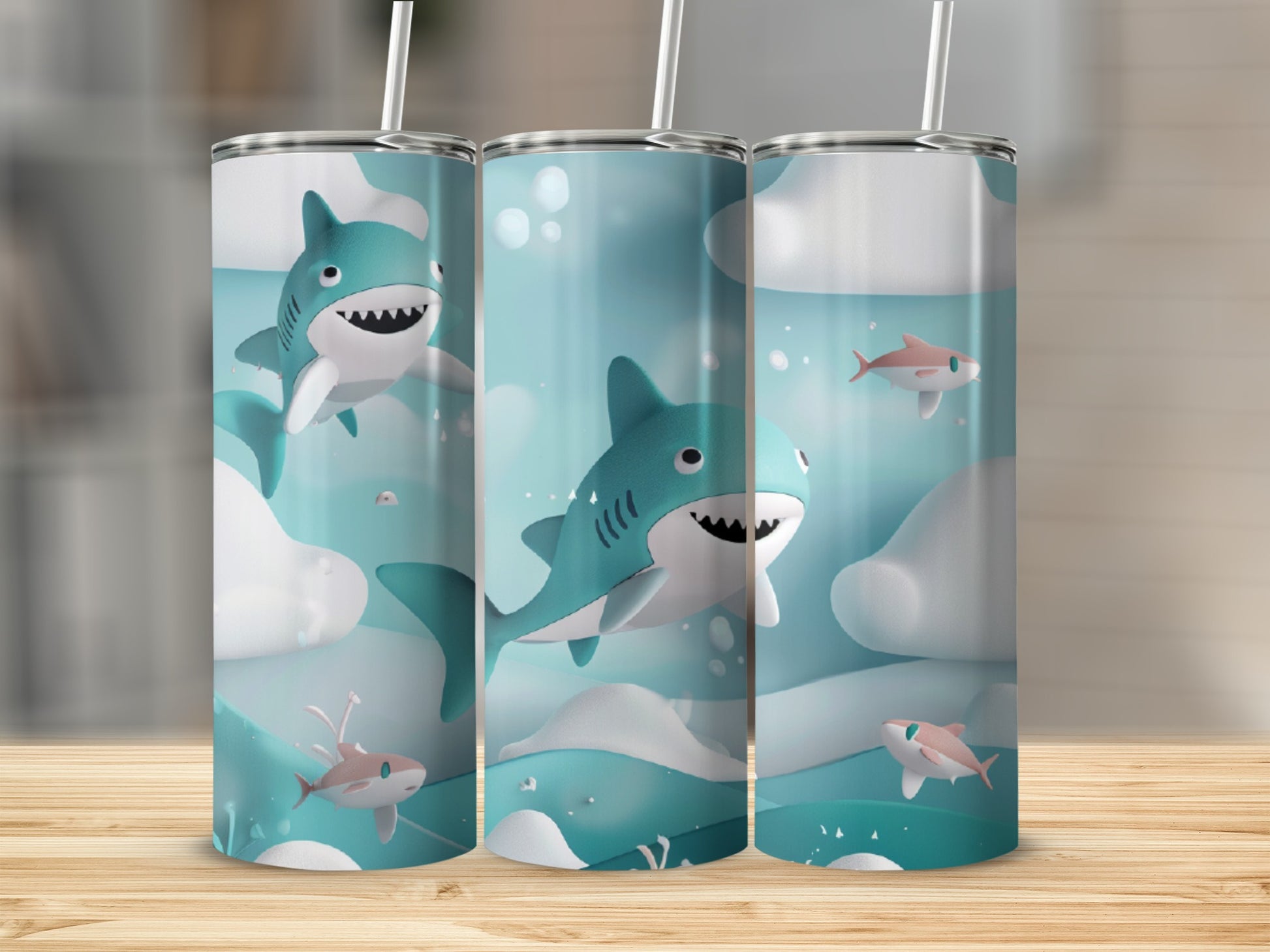 Three tumblers with cartoon sharks and clouds on a wooden surface.