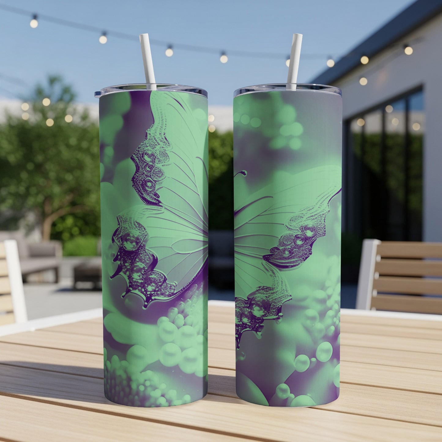 Two tumblers with a purple and green butterfly design and bubbles.