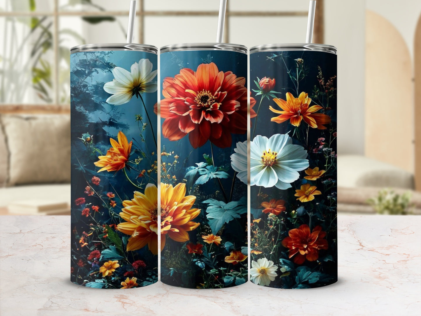 Three tumblers featuring vibrant floral designs of dahlias and other flowers.