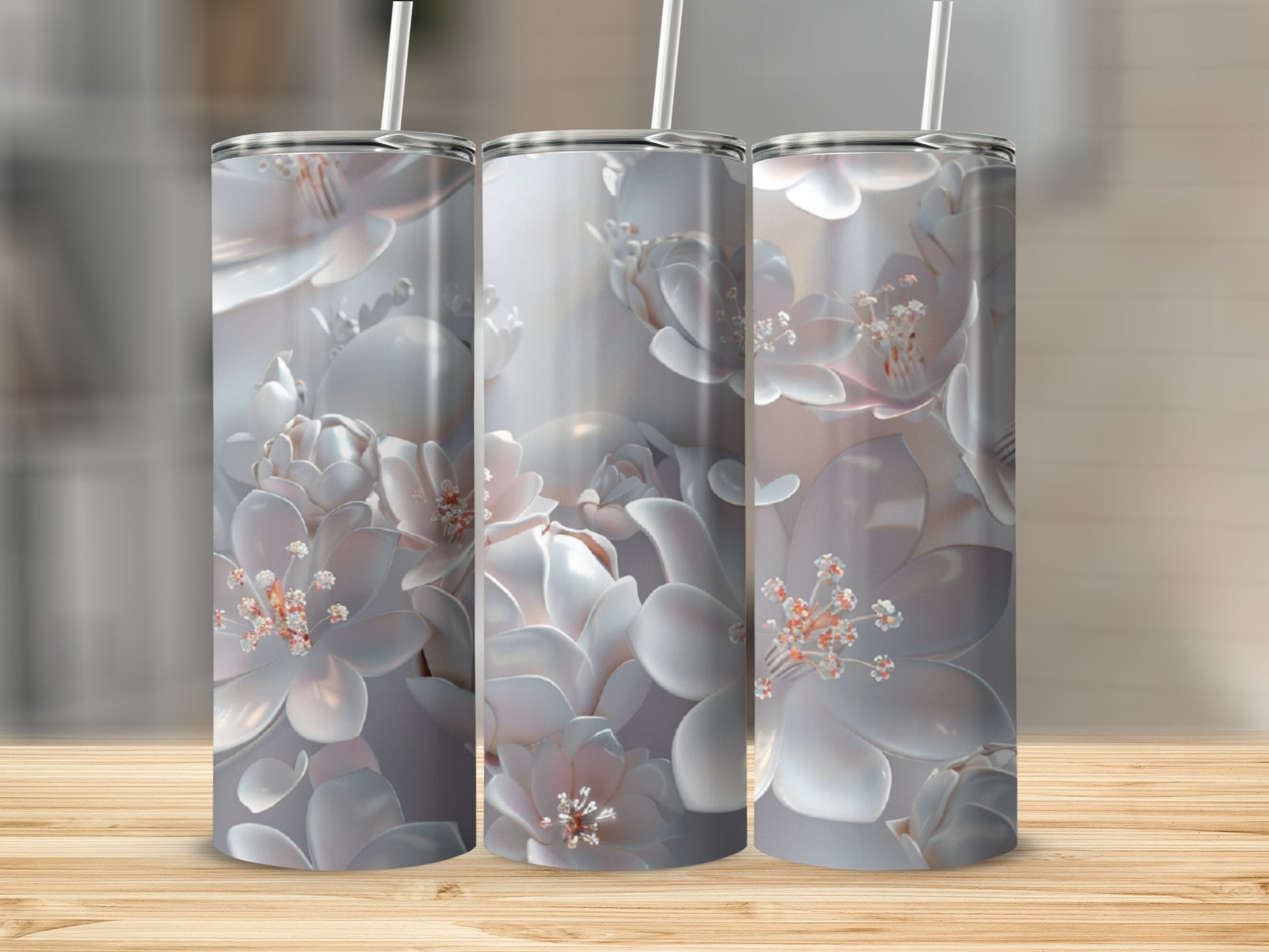 Three tumblers with a 3D floral design, displayed on a wooden surface.