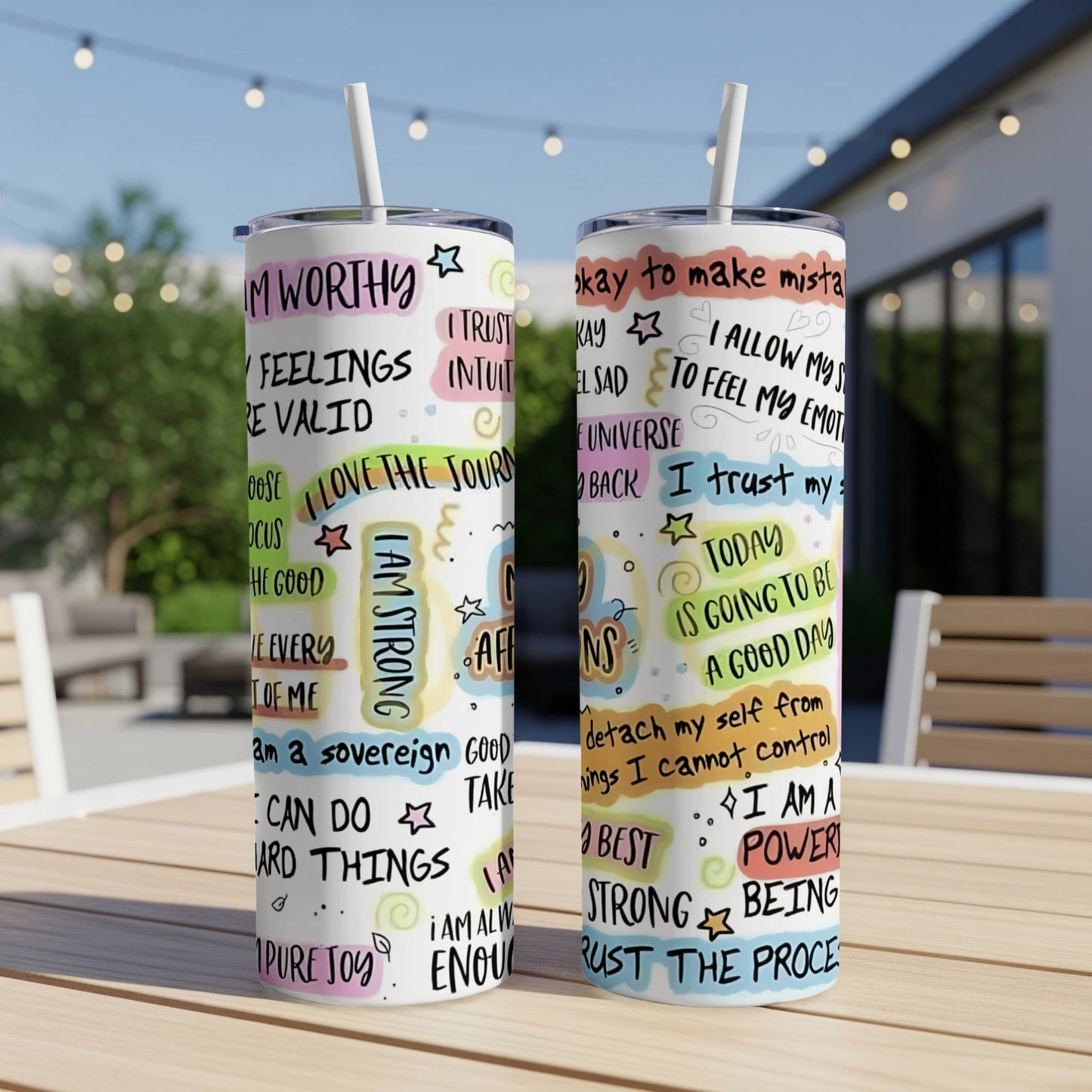 Two tumblers with motivational text and colorful illustrations.