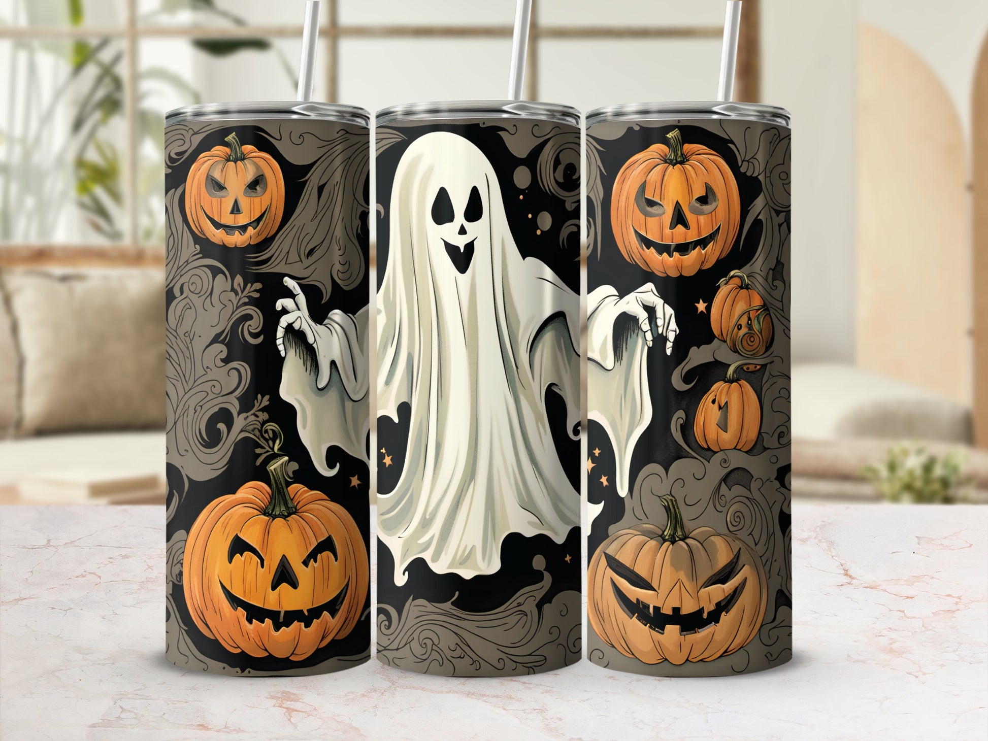 Three tumblers feature a ghost and jack-o'-lantern Halloween design with ornate swirls.
