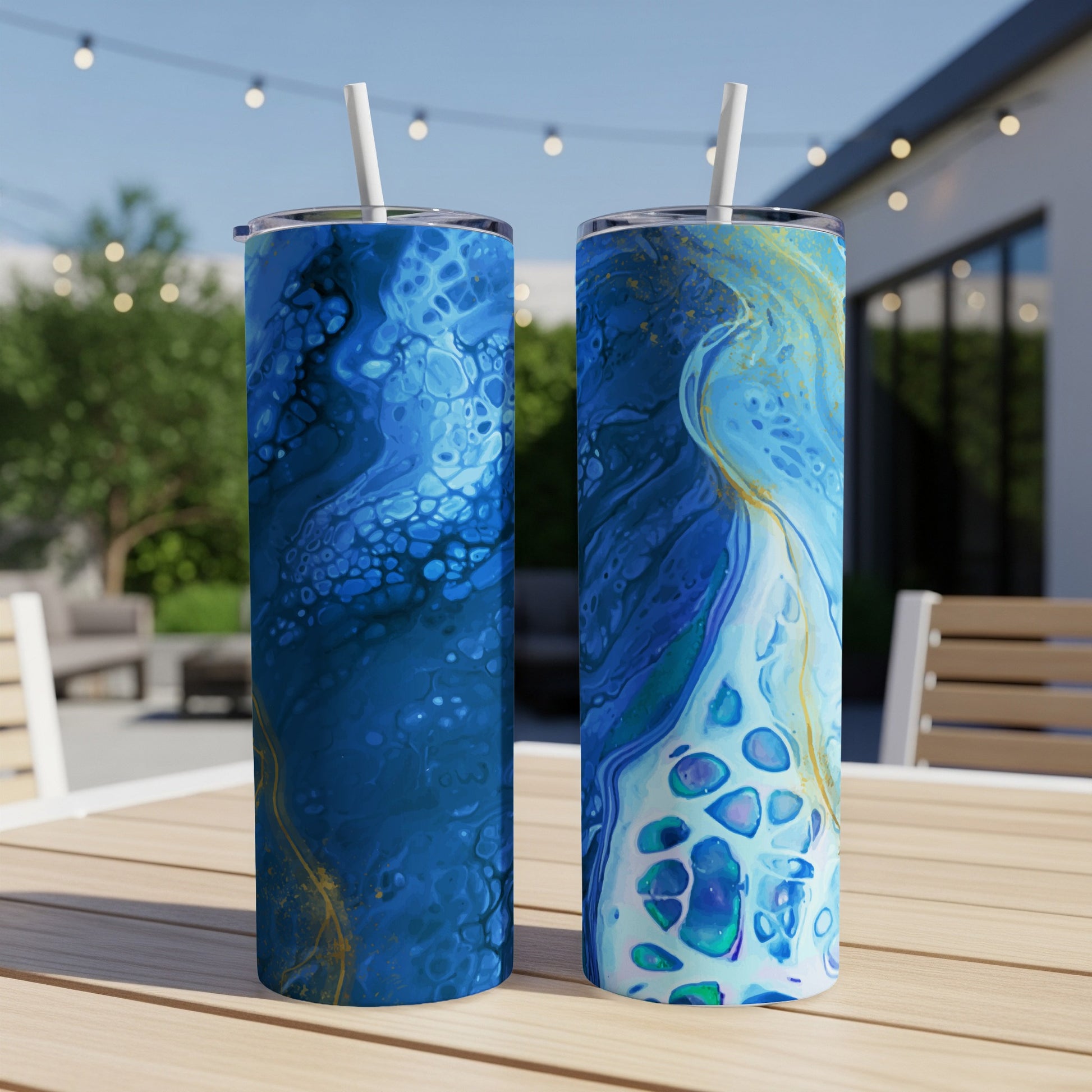 Two tumblers with swirling blue, teal, and gold fluid art patterns.