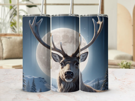 Deer and moon design on three travel tumblers in a rustic setting.