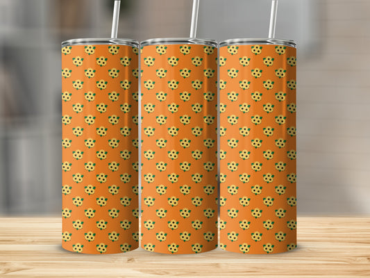 Three tumblers with a repeating sunflower pattern on an orange background.