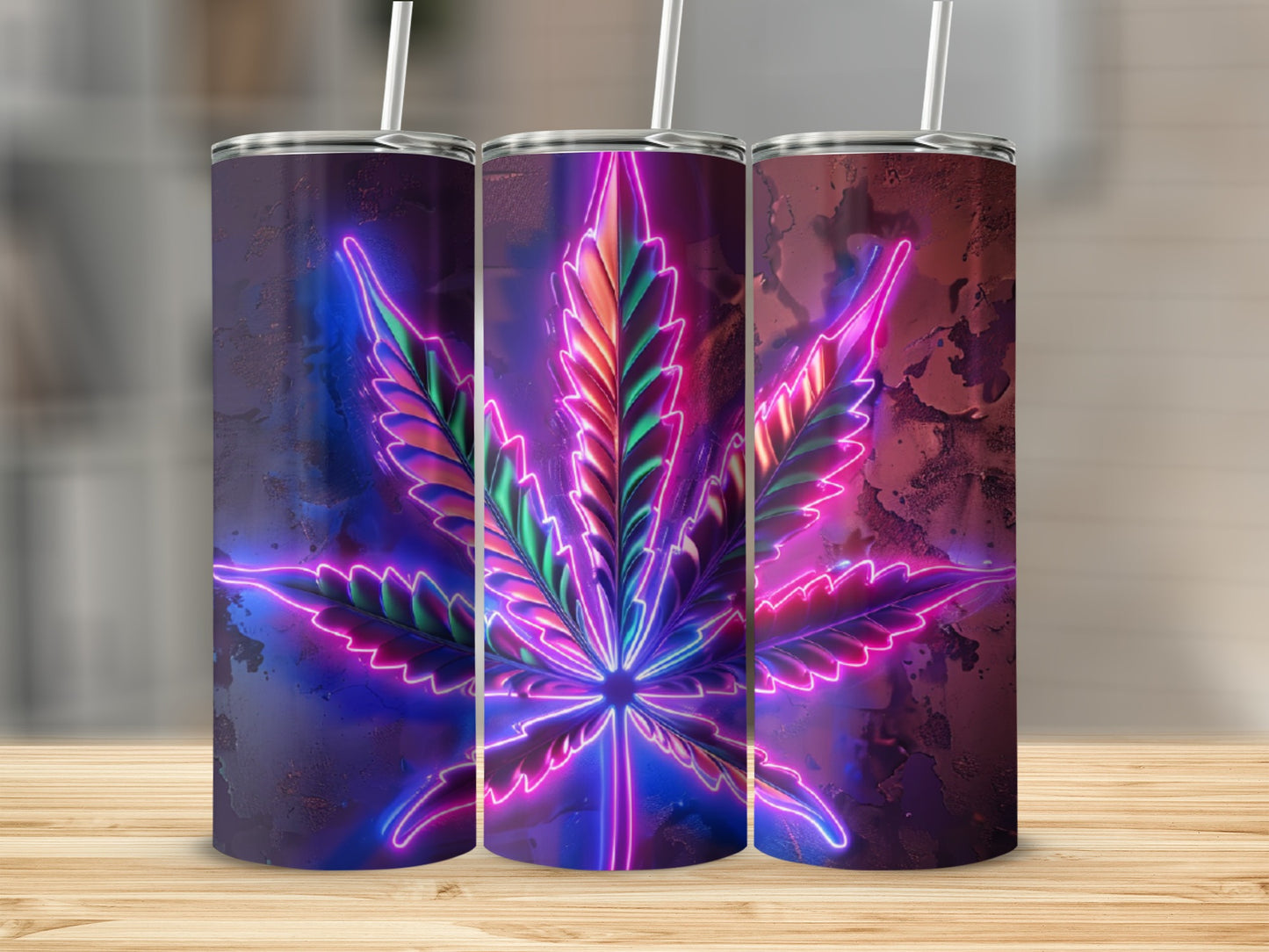 Neon cannabis leaf design on three tall, skinny tumblers.