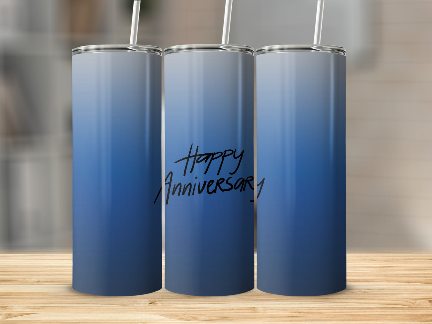 Blue ombre tumbler with "Happy Anniversary" text and straw.
