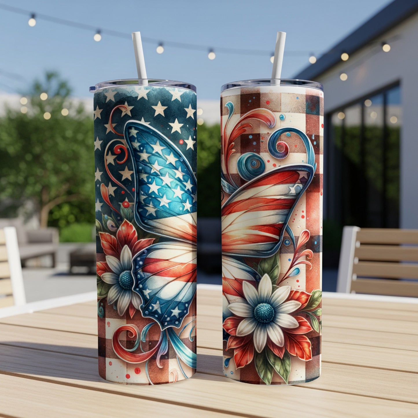 Two patriotic butterfly tumblers with floral accents on a table.