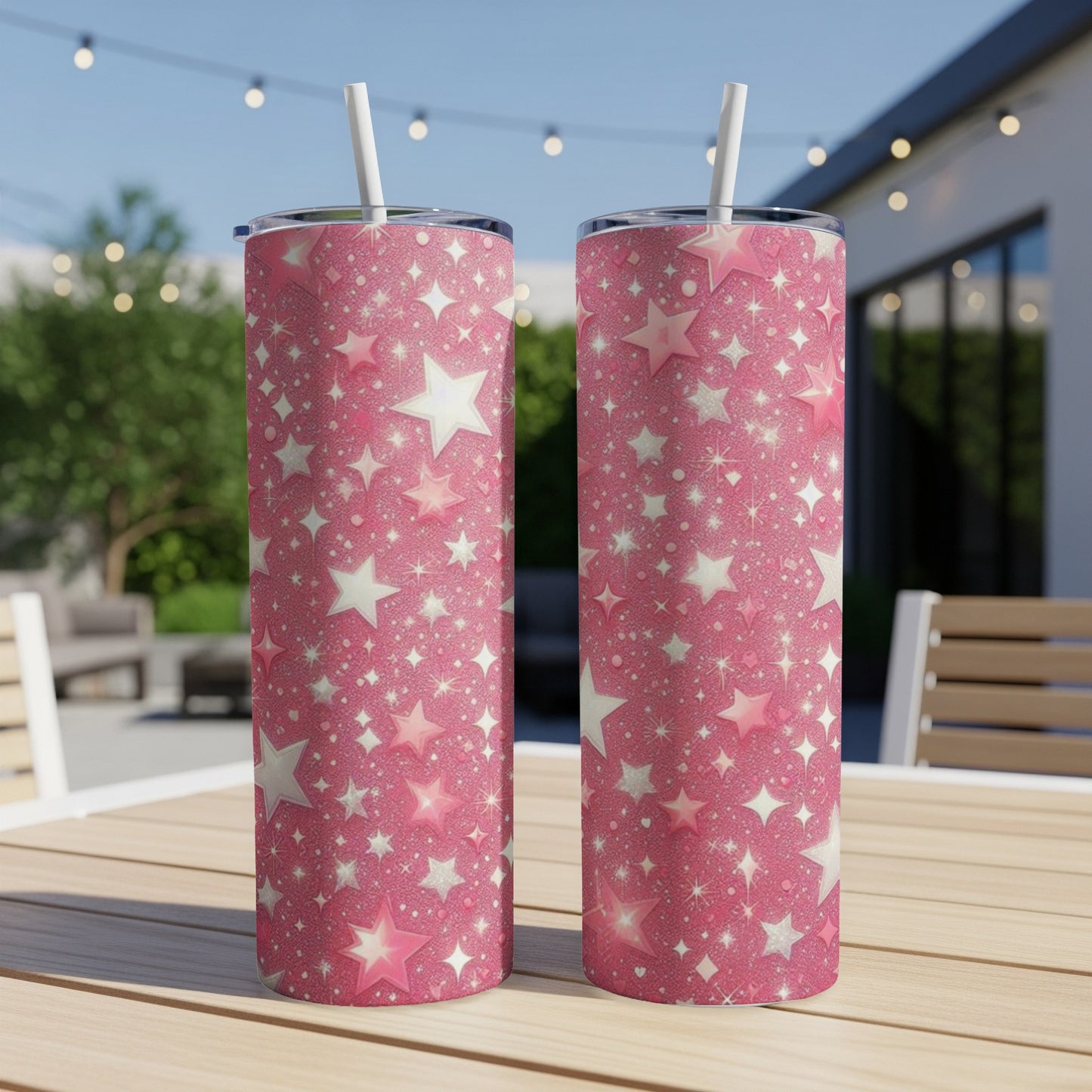 Two pink glitter tumblers with a star pattern sit on a table.