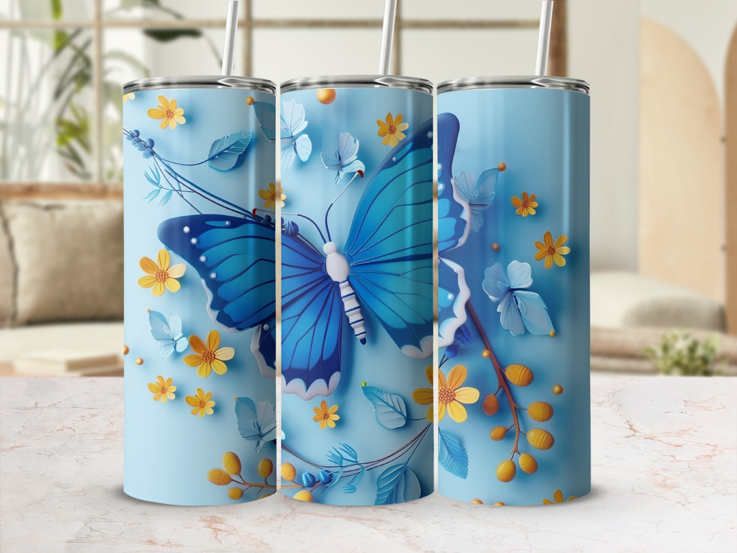 Blue butterfly and floral design on a light blue tumbler.