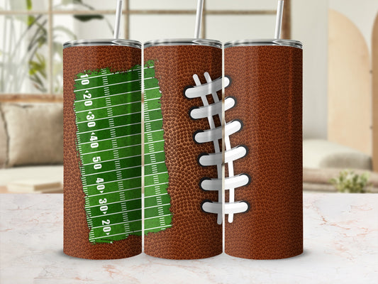 Brown tumbler with football laces and green yard markers.