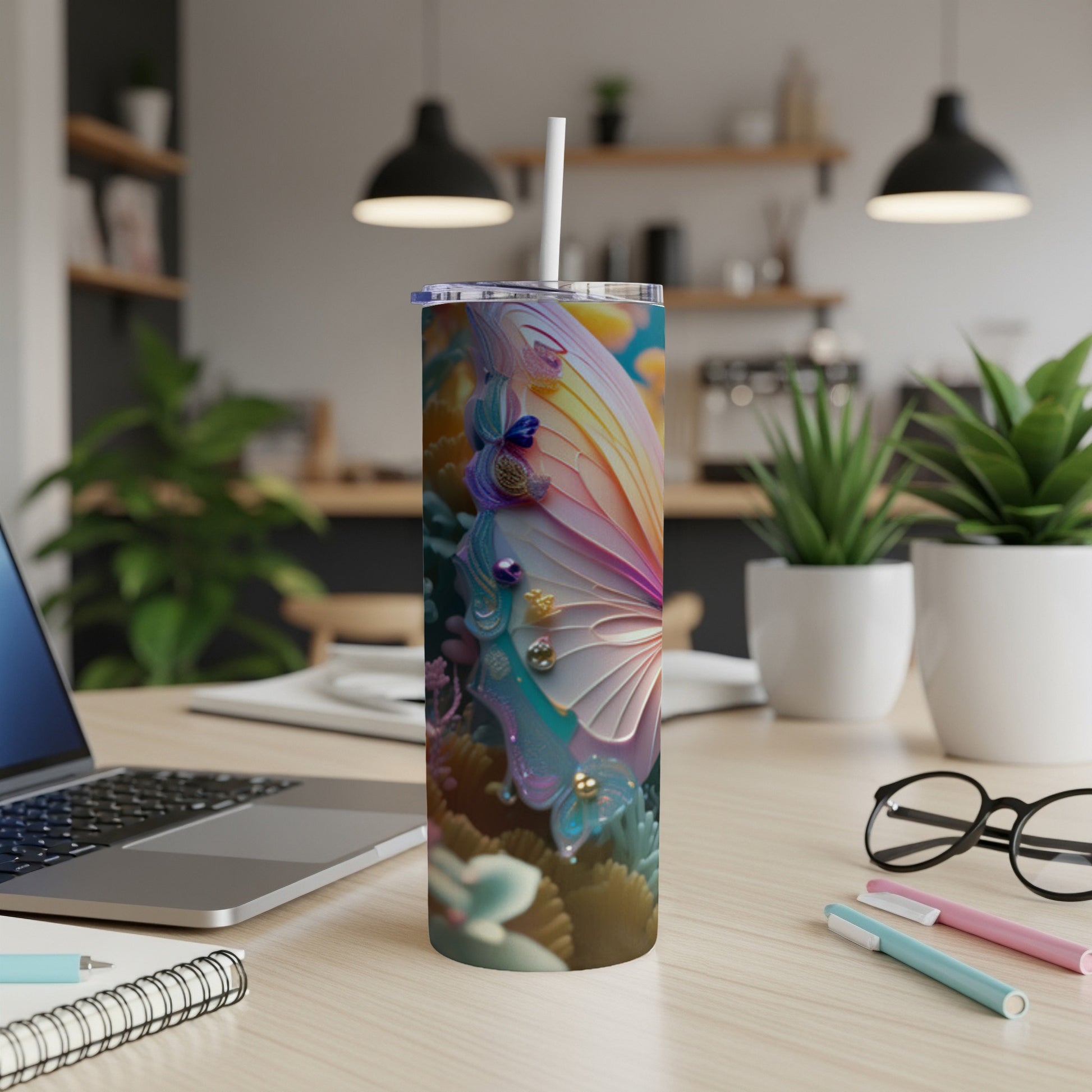 Tumbler with colorful butterfly wings and floral designs.