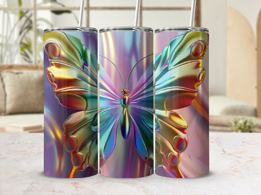 Iridescent butterfly tumbler with straw on a marble surface.