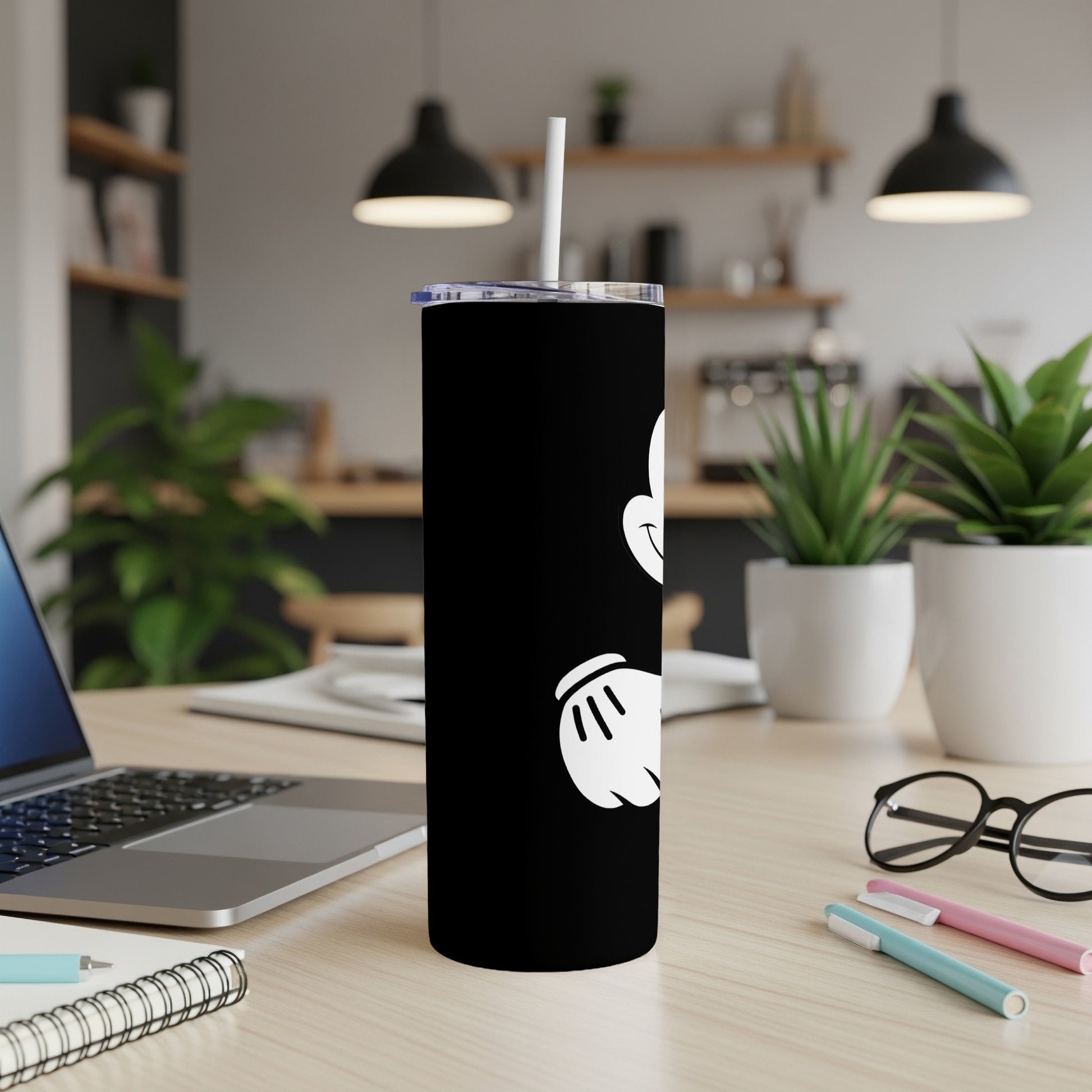 Black tumbler with Mickey Mouse graphic and white straw.