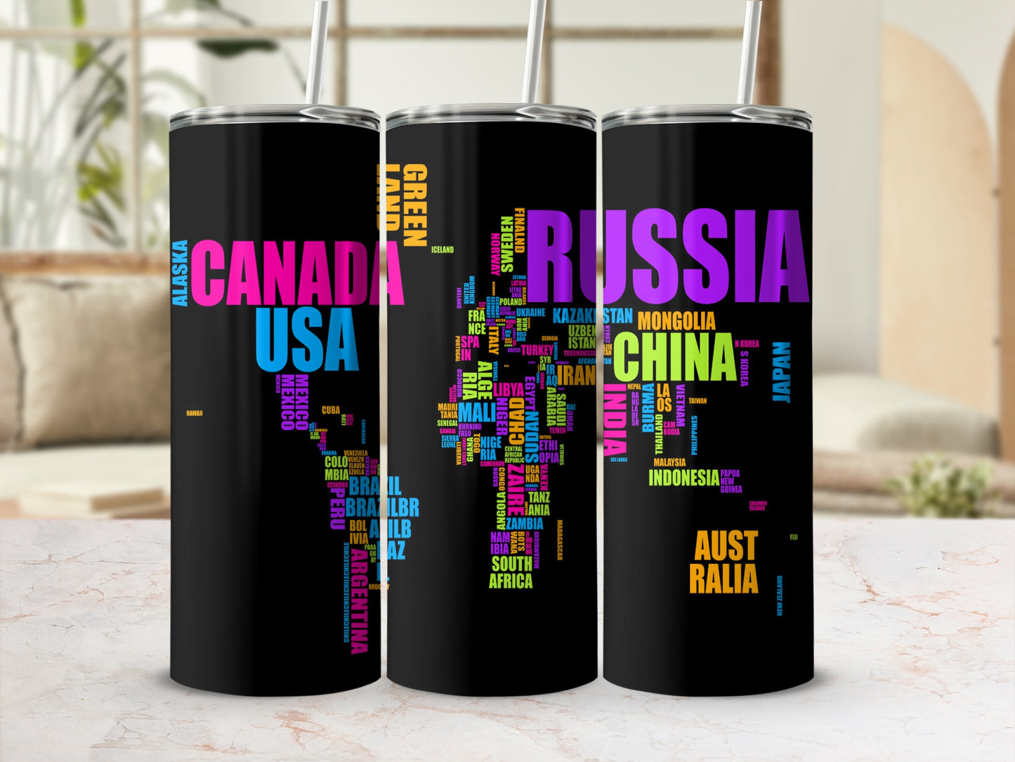 Black tumblers with a world map formed by country names in bright lettering.