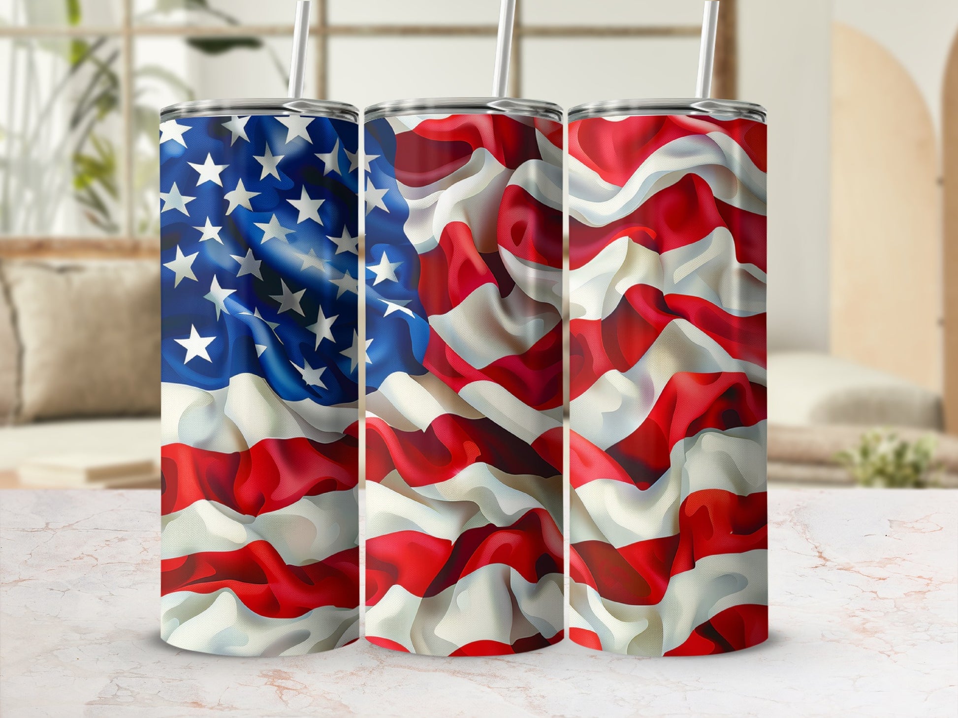 Three tumblers with American flag design against a blurred background.